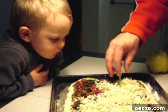 Delicious homemade pizza being prepared with fresh ingredients, showing the simple joy of making pizza at home.