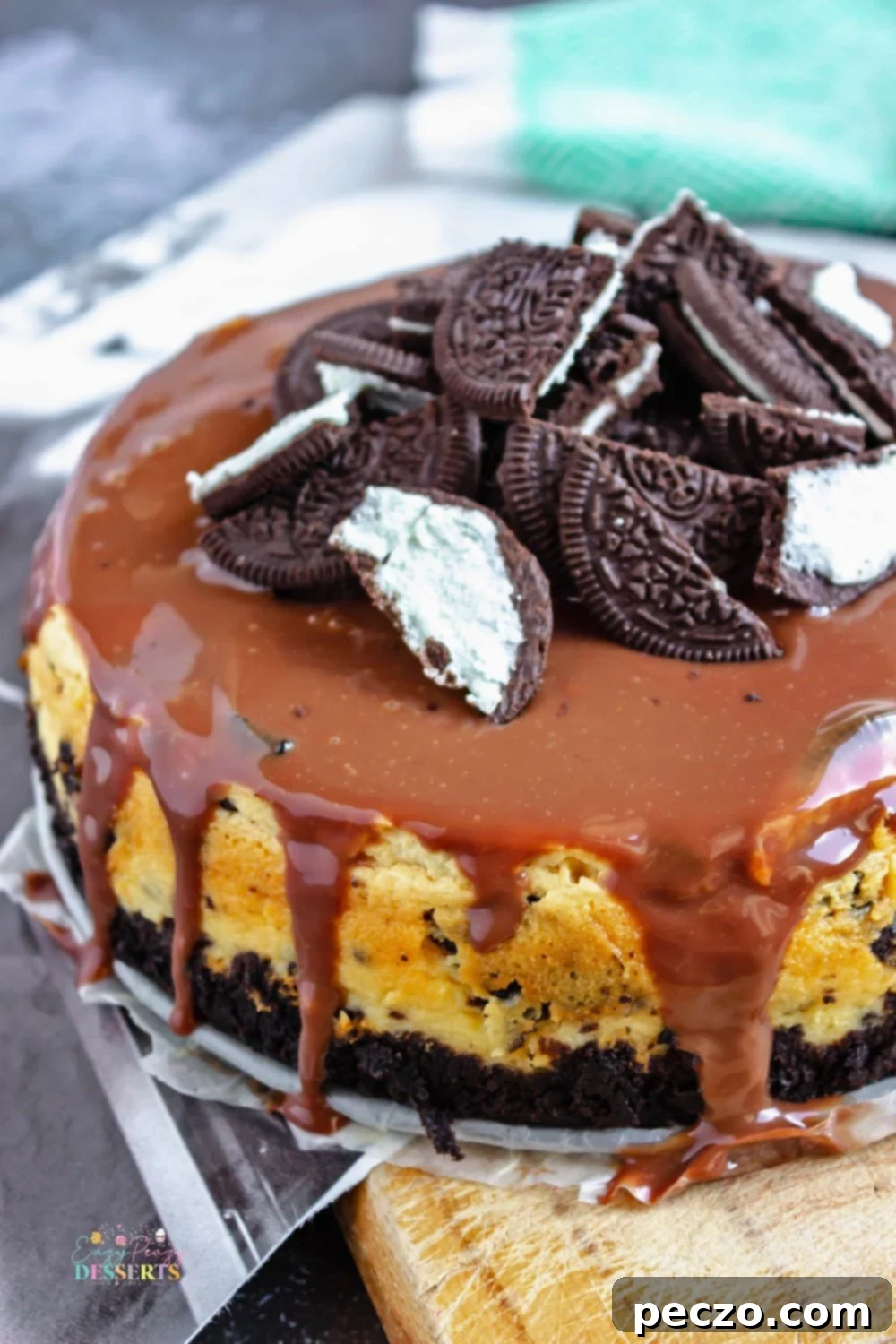 Close up image of Oreo cheesecake with chocolate ganache on top