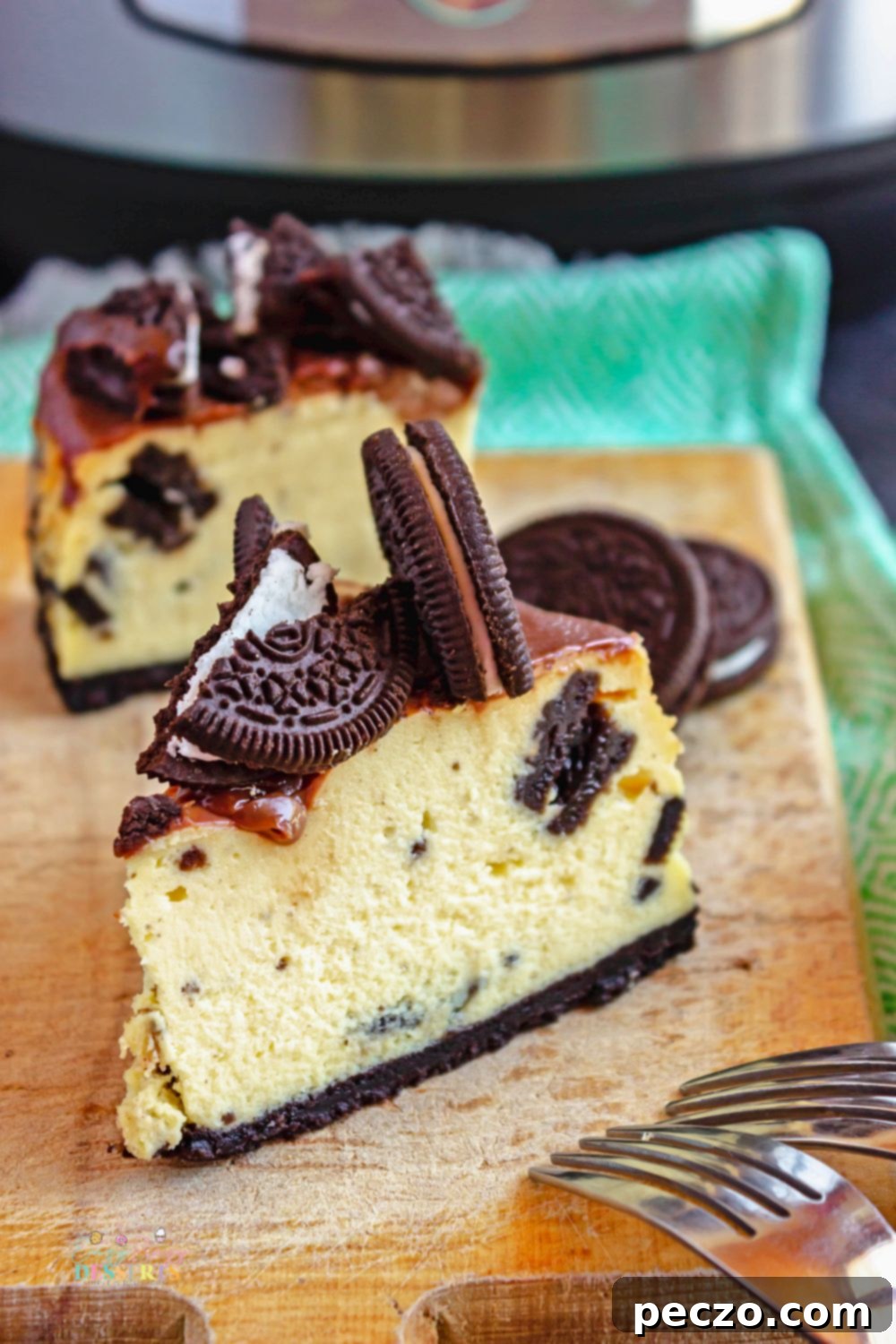 Image of a slice of Instant Pot cheesecake with Oreo cookies