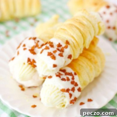 A close-up of a gingerbread cream horn, showcasing its perfect form and festive decoration.