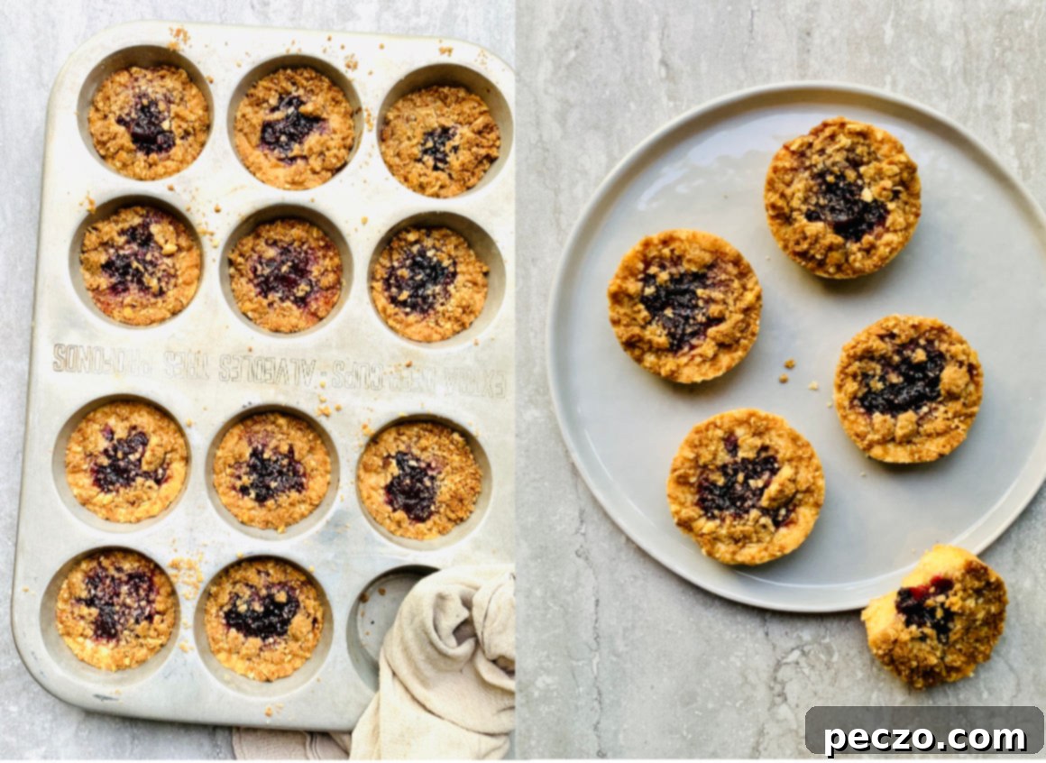 Close-up of a Muffin Tin Jam Cookie, showing the crumble topping and jam filling