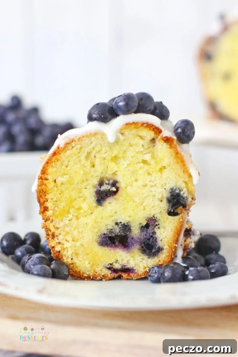 Image of donut Bundt cake with vanilla glaze and blueberries