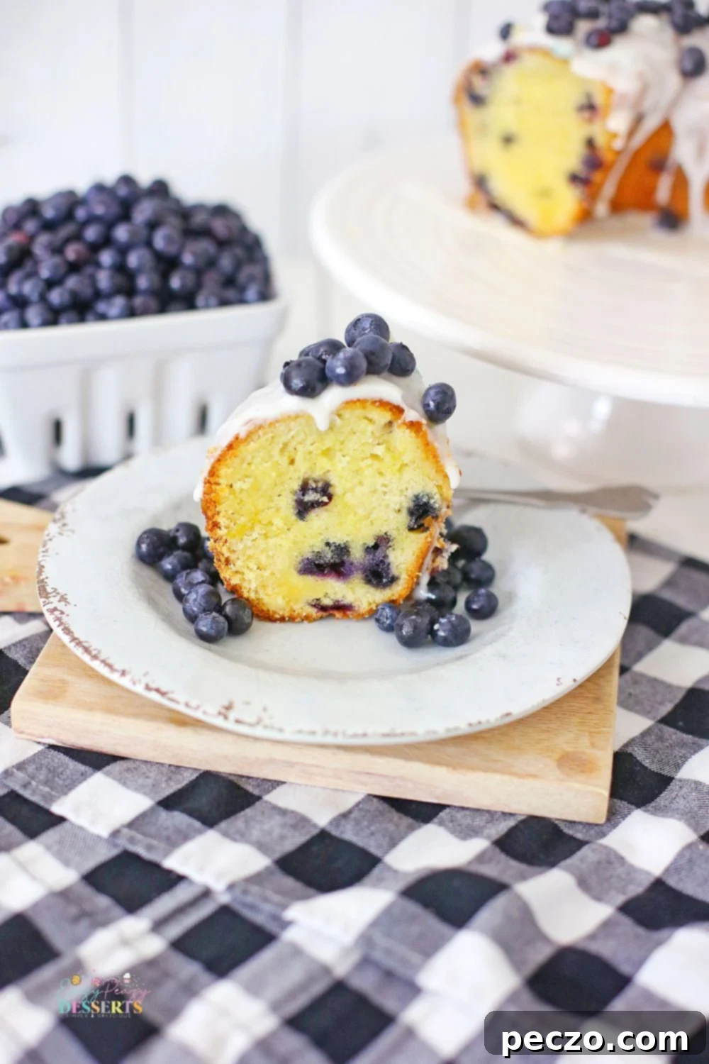 Image of a slice of blueberry Bundt cake with vanilla glaze