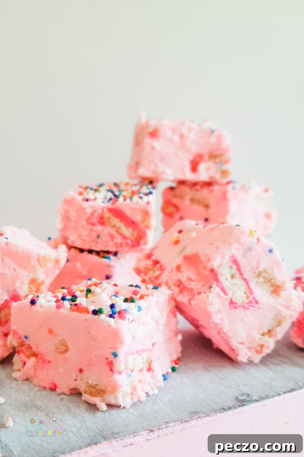 A few squares of strawberry funfetti fudge with circus cookies