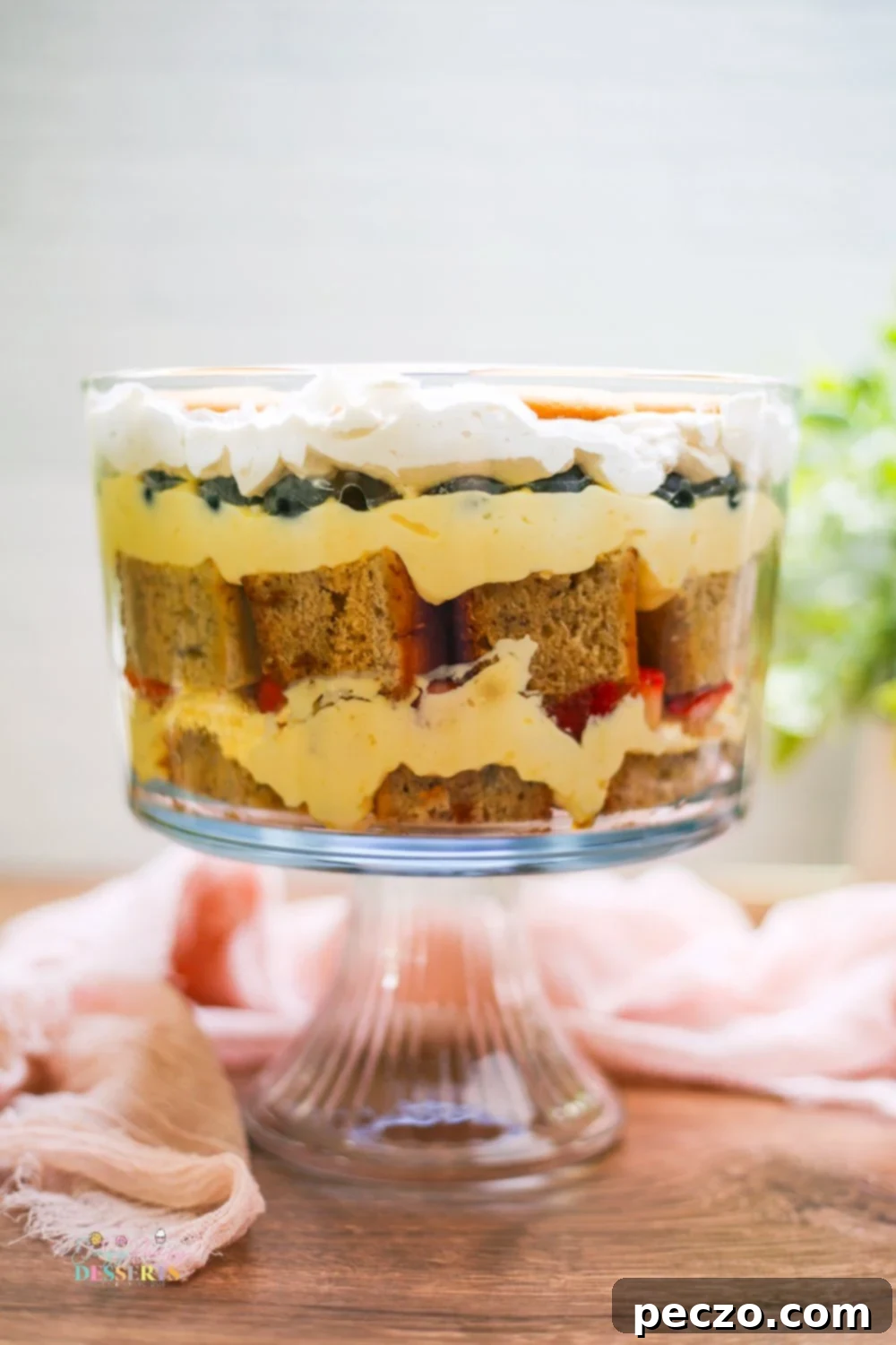 Close up image of strawberry banana trifle in a trifle bowl