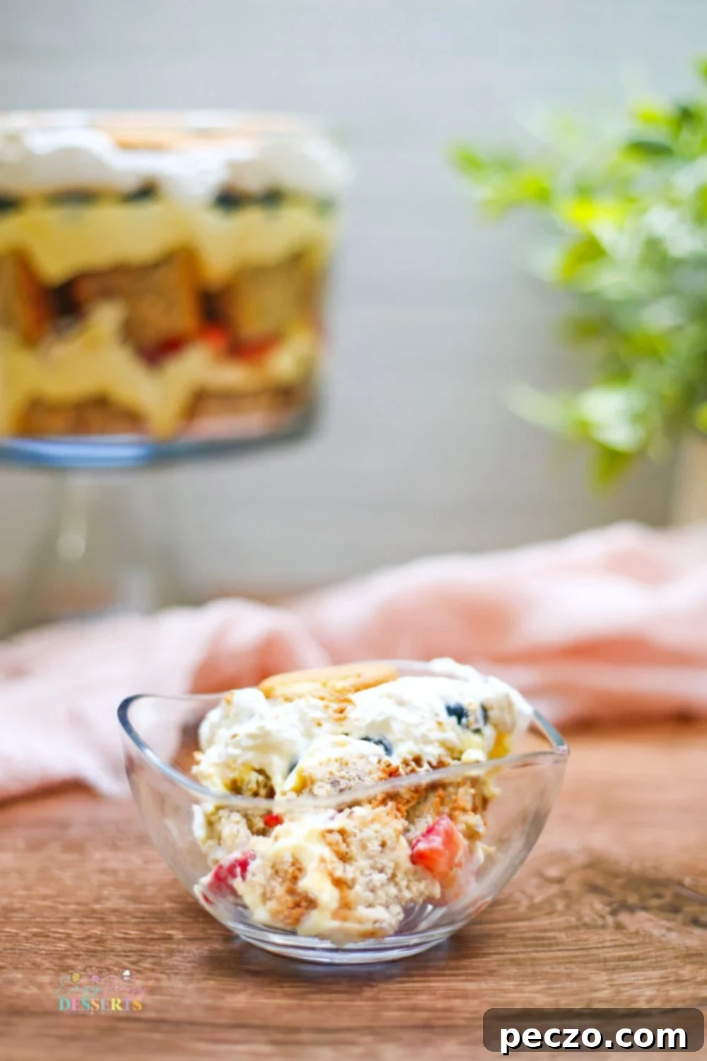 Close up image of cake trifle made with banana cake trifle, strawberry and blueberry