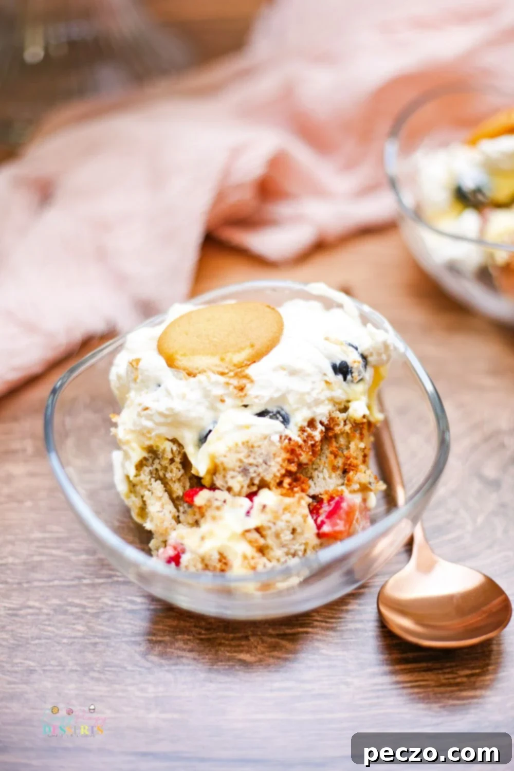 Angle image of a serving of banana trifle in a dessert bowl