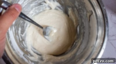 Preparing the maple glaze for vegan pumpkin donuts.