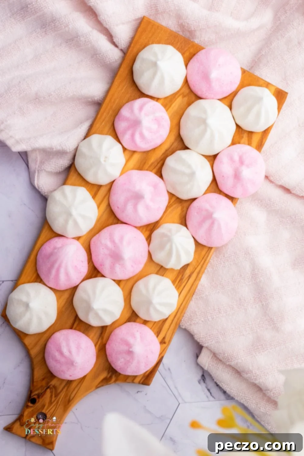 Image of pink and white lemon vegan meringue cookies