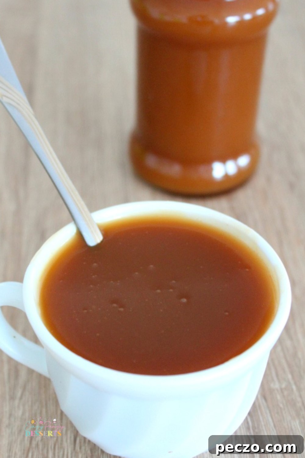 Salted caramel sauce in a small glass jar, sealed and ready for storage or immediate serving