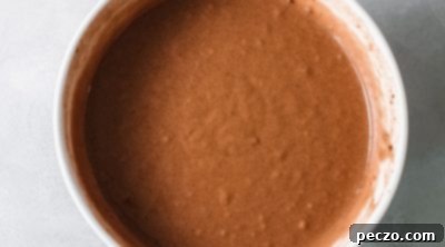 Pouring cake batter into a pan