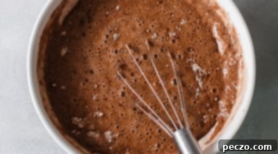 Combining wet and dry ingredients for chocolate cake