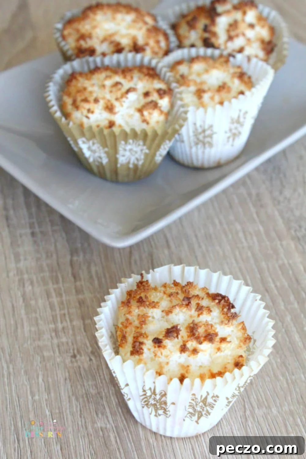 Delicious gluten-free coconut muffins on a baking tray, ready to be served.