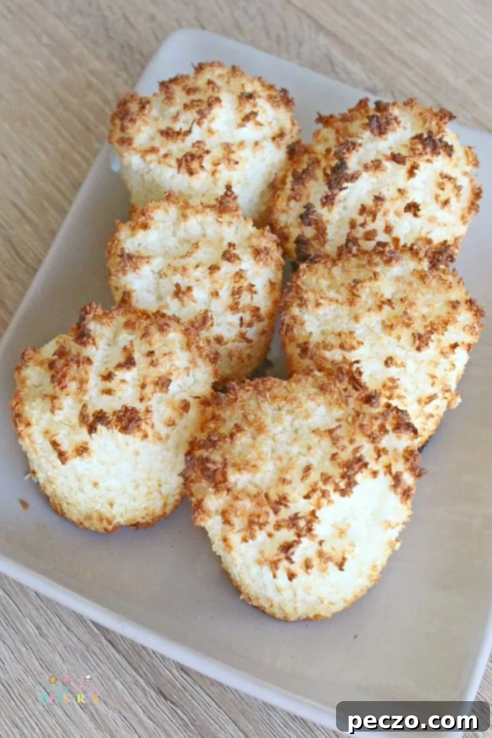 Image of coconut macaroons baked directly in a muffin pan, showing golden brown edges.