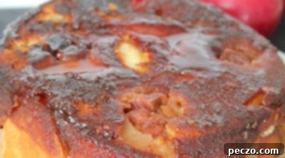 Close up image of apple upside down cake on a plate