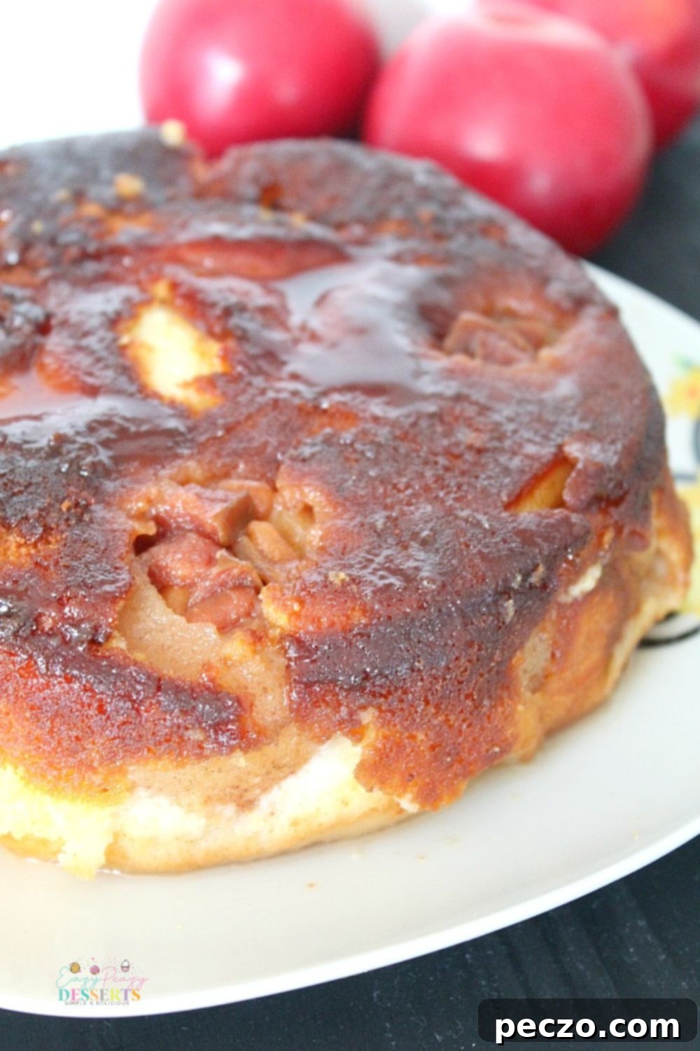 Angled photo of a beautifully baked caramel apple upside down cake, fresh out of the oven