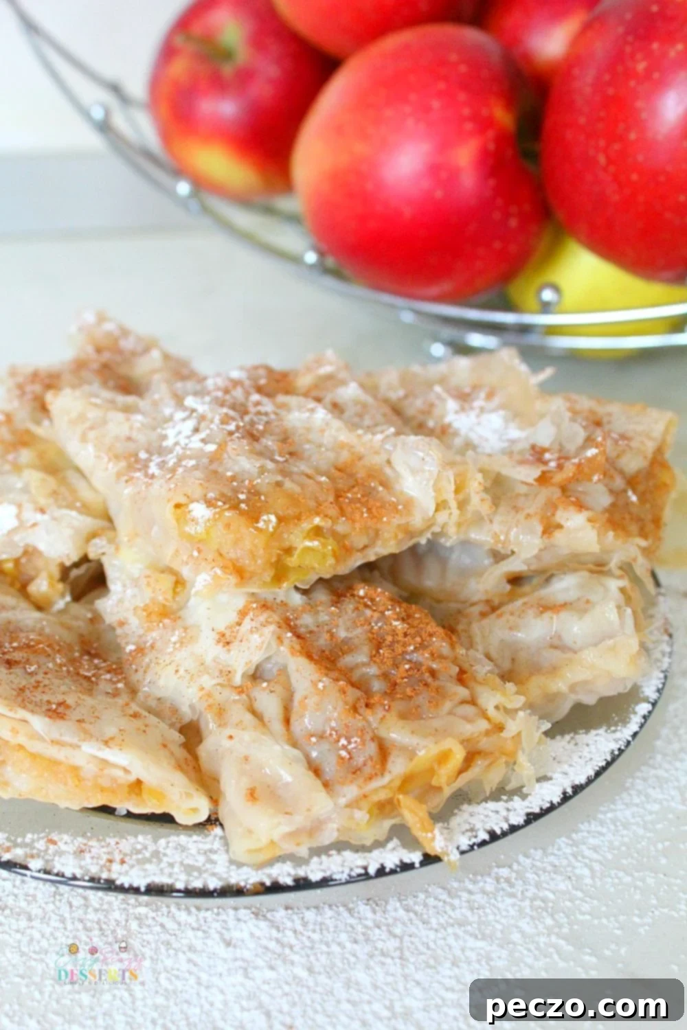 A few squares of filo apple pie on a plate