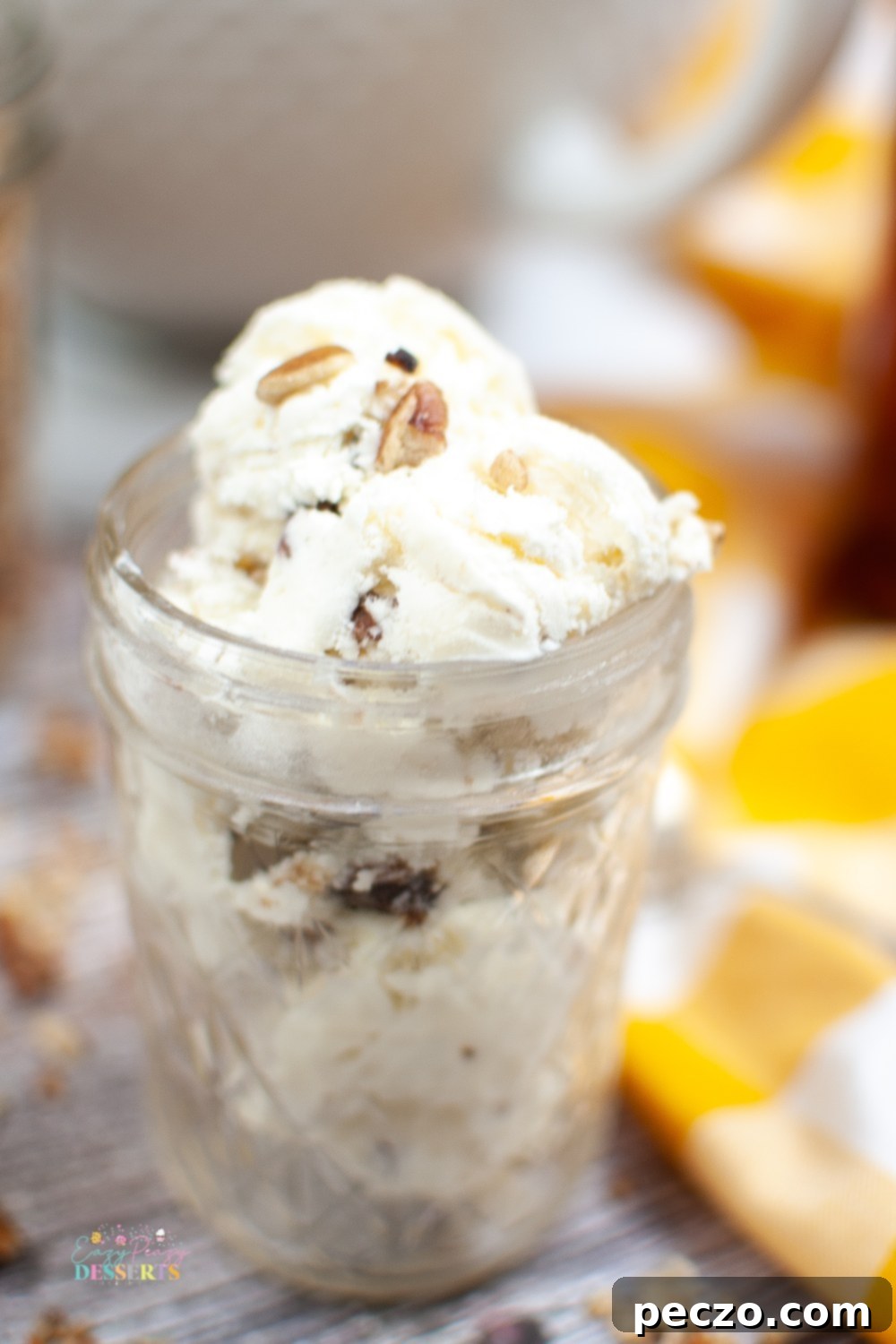 Close up image of ajar filled with homemade butter pecan ice cream
