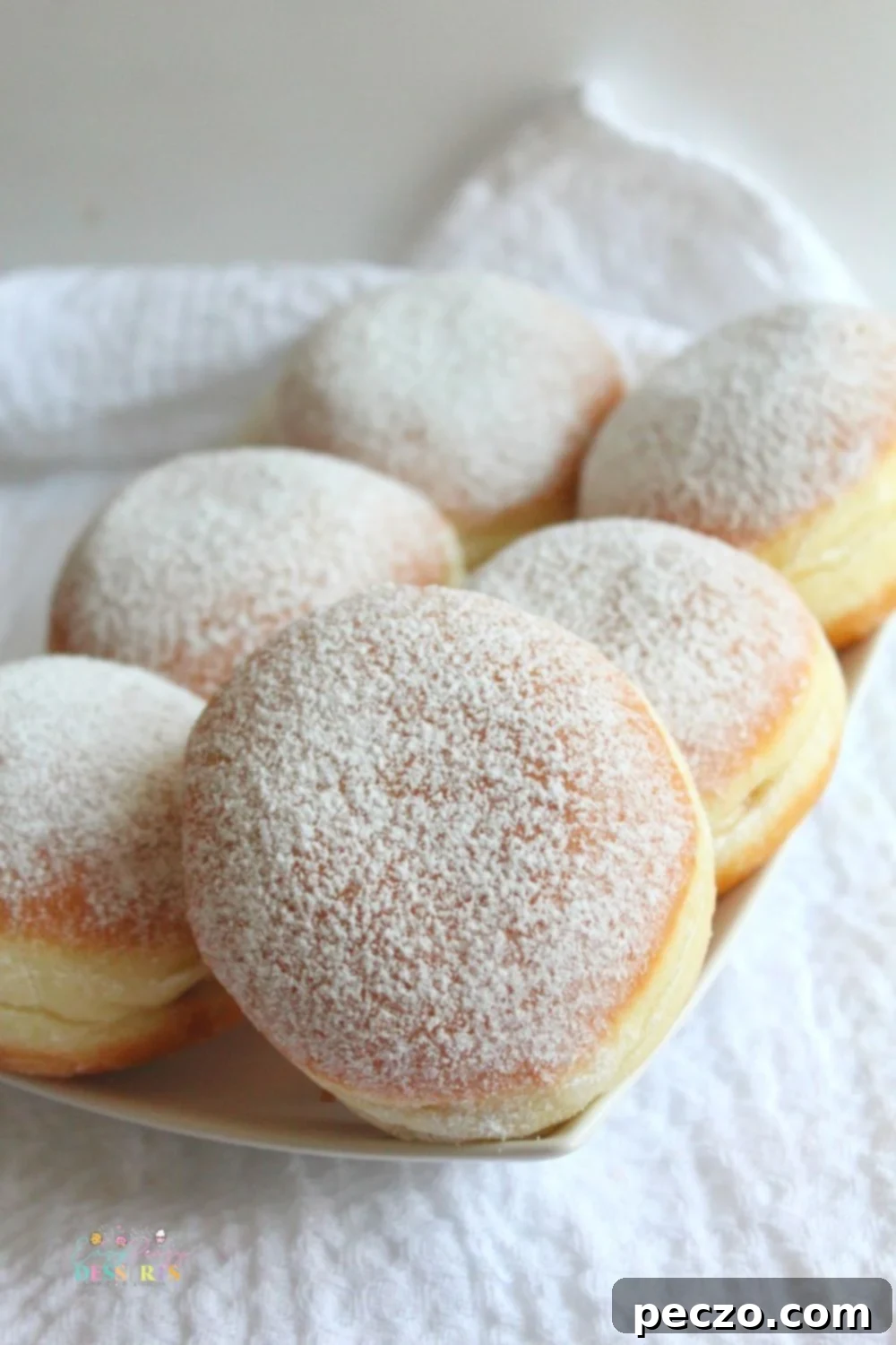 Close p image of jelly donuts filled with strawberry jam