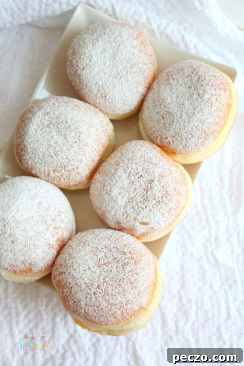Image of six jam filled donuts on a plate