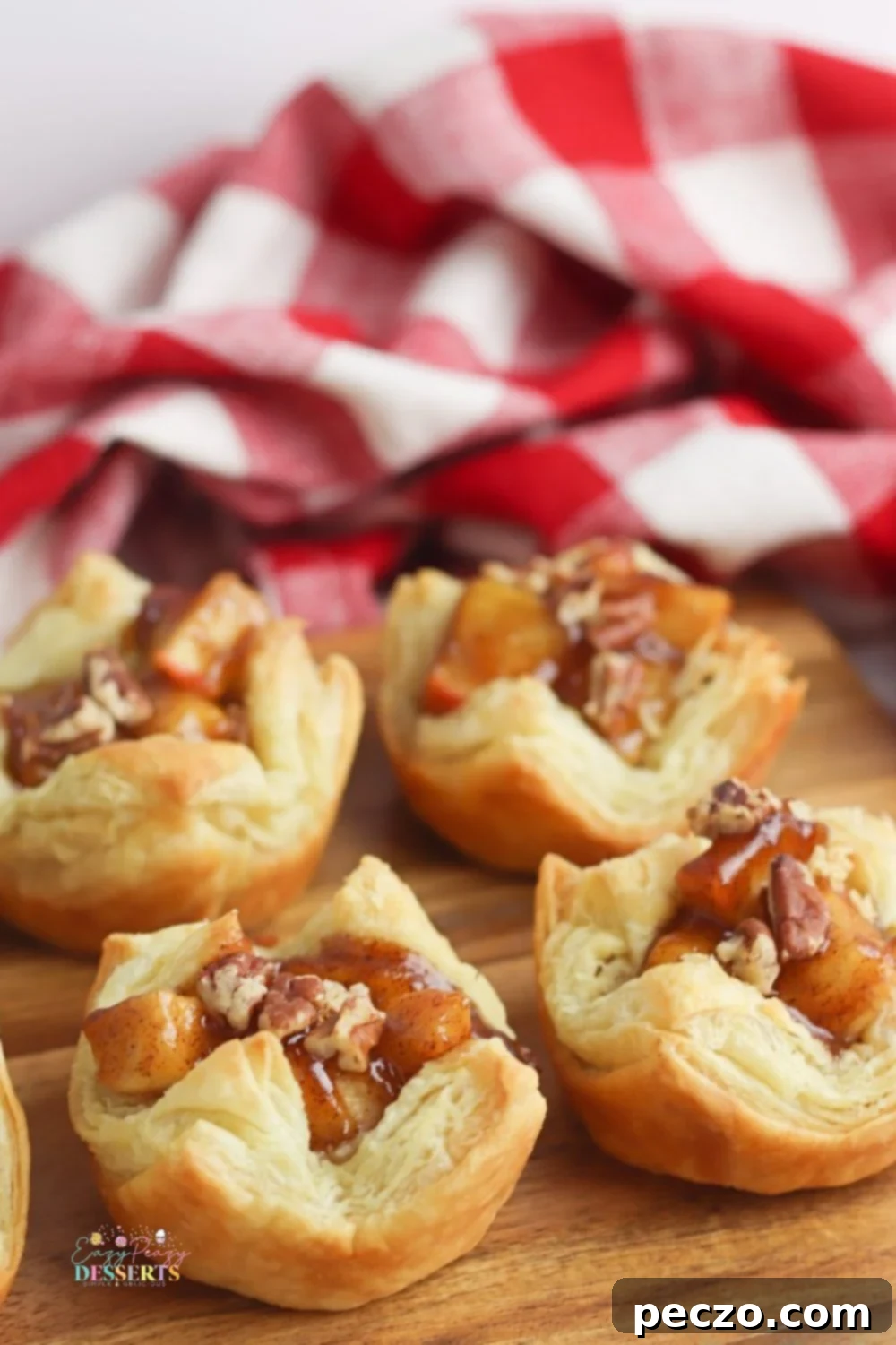 Delicious mini apple pies in flaky puff pastry cups
