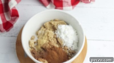Spices and brown sugar added to apple filling