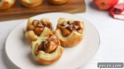 Mini apple pies cooling on a wire rack