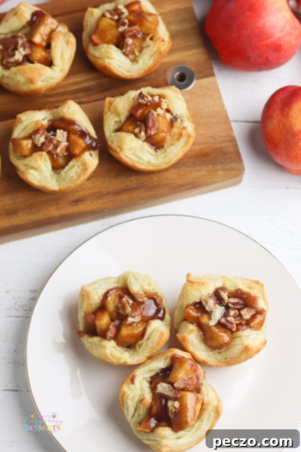 Individual apple pies in golden puff pastry shells