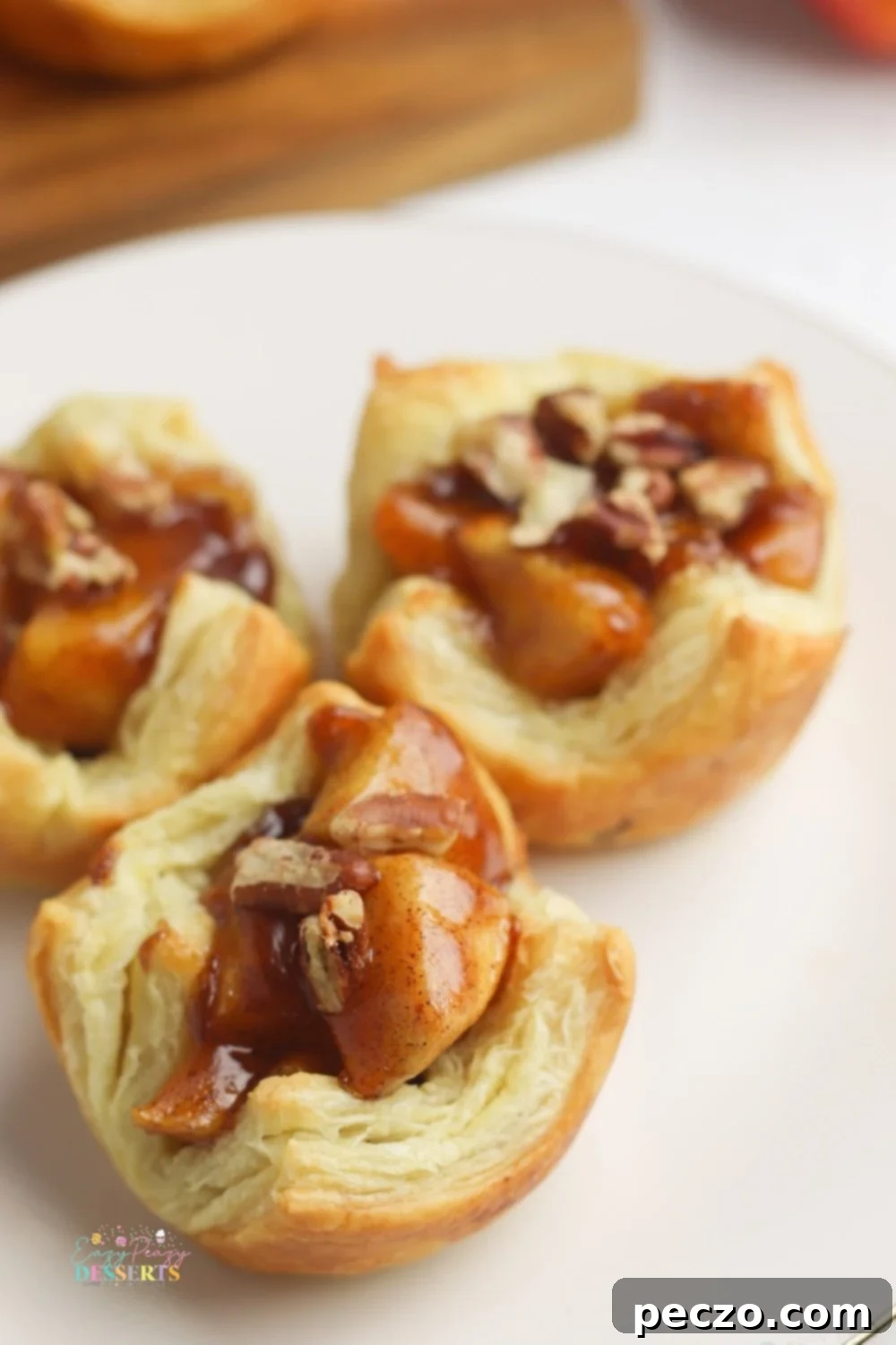 Close up of mini apple pies with cinnamon and pecans