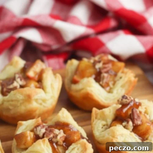 Mini apple pies in puff pastry cups, ready to be served