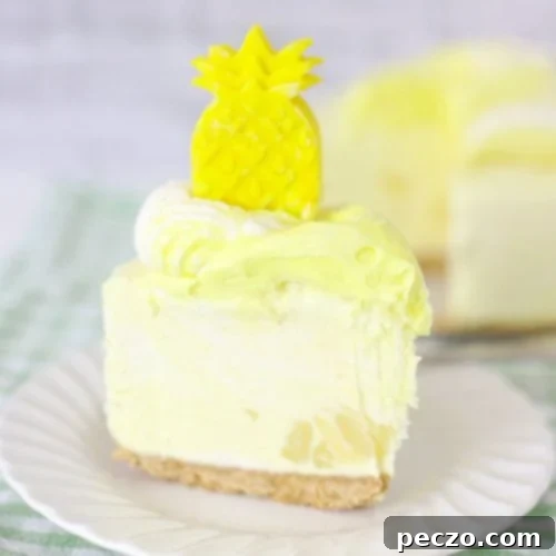 A slice of pineapple cheesecake on a white dessert plate