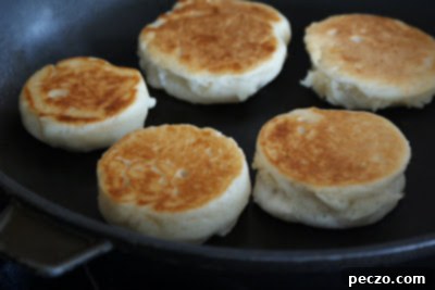 Pierre's Signature Crumpets 6 Golden brown, perfectly cooked crumpets cooling on a wire rack