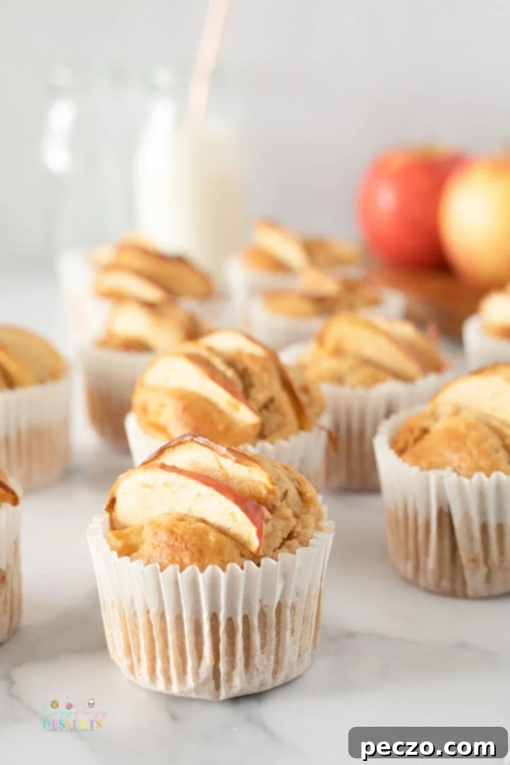 Close up image of homemade apple muffins in cupcake liners