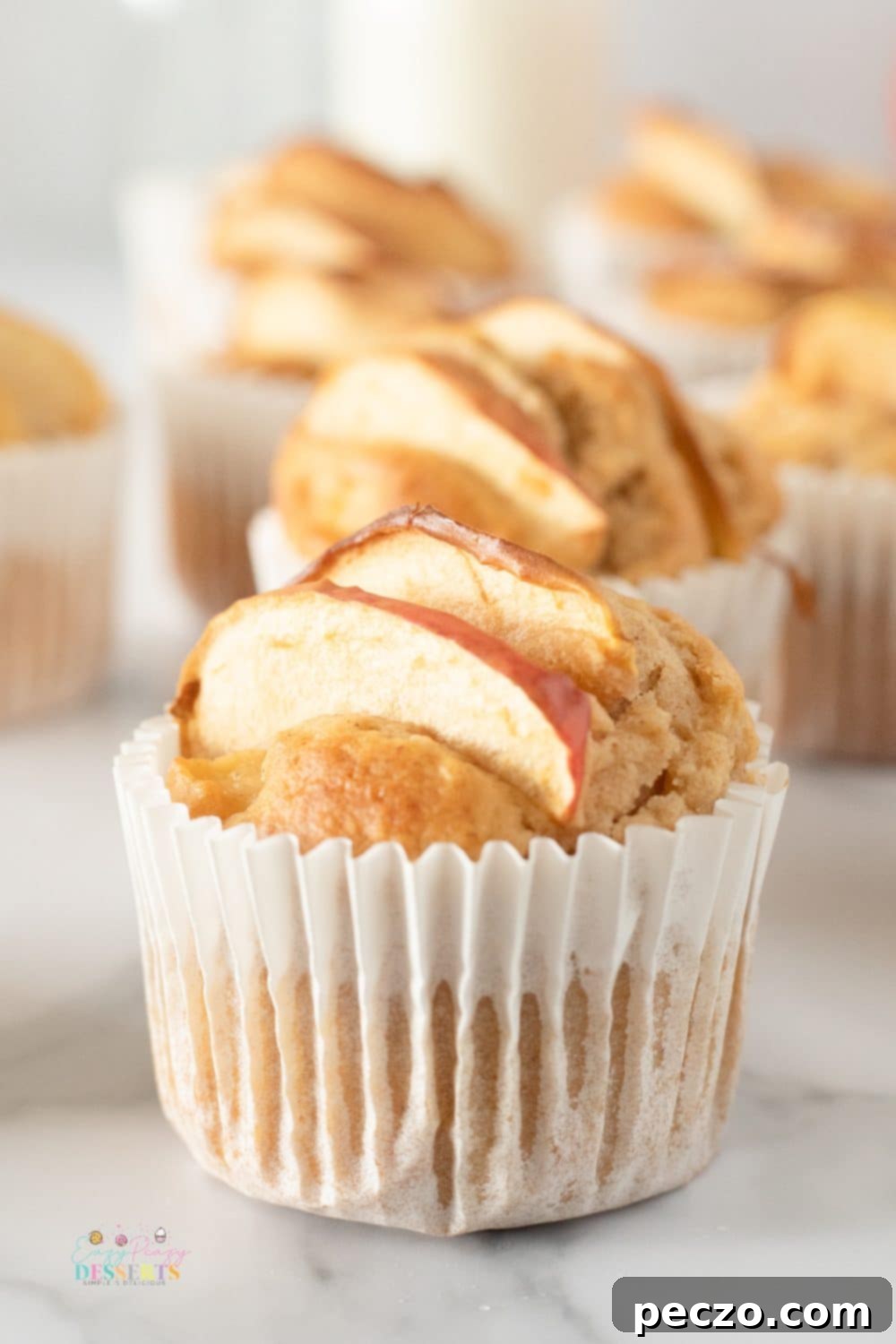 Front image of a muffin made with a homemade apple muffins recipe