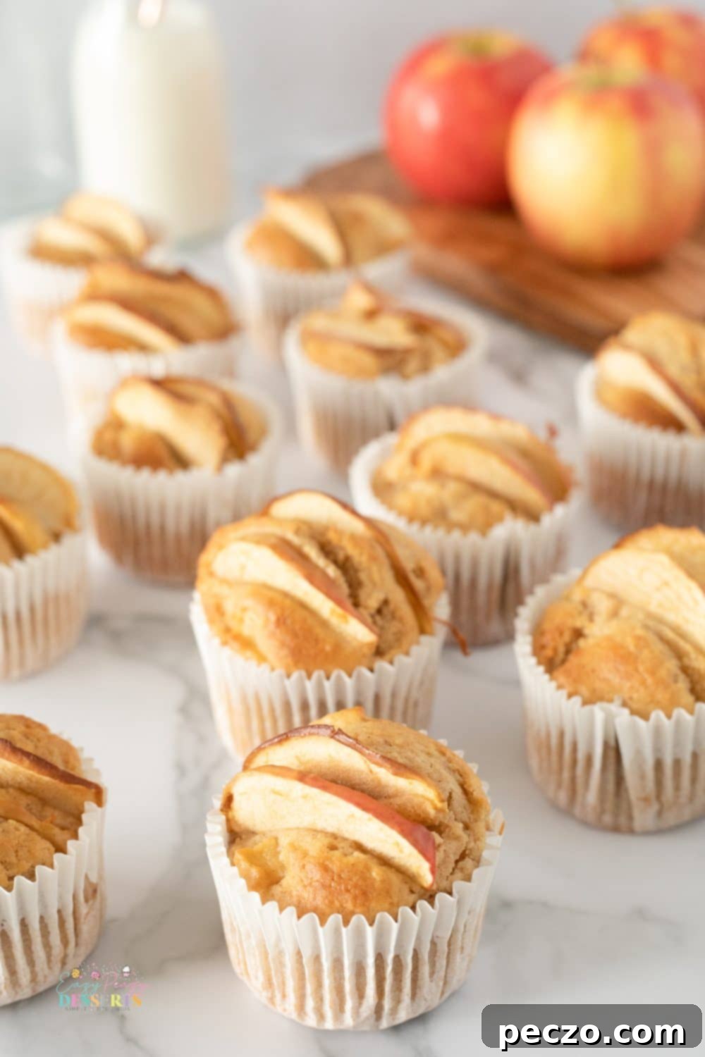 Angle image of apple and cinnamon muffins in cupcake liners