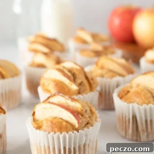 Close up image of homemade apple muffins in cupcake liners