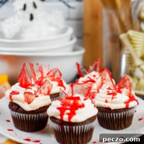 Close up image of bloody Halloween cupcakes on a serving plate