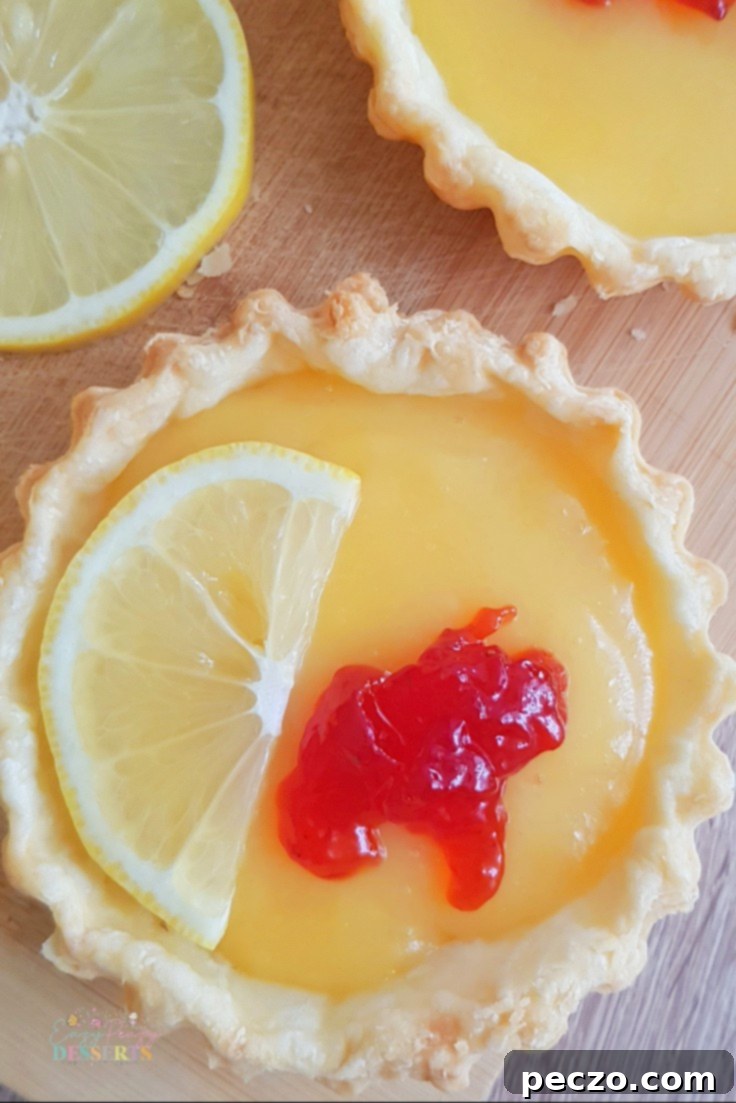 Assortment of Easy Lemon Tarts with various toppings, ready to be served
