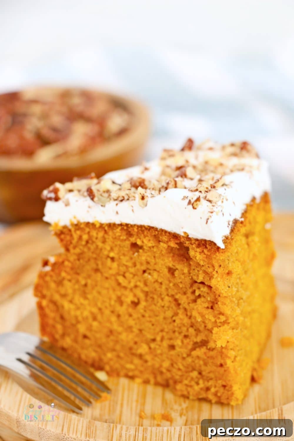 Close up image of a slice of air fryer cake with pumpkin, ready to be served