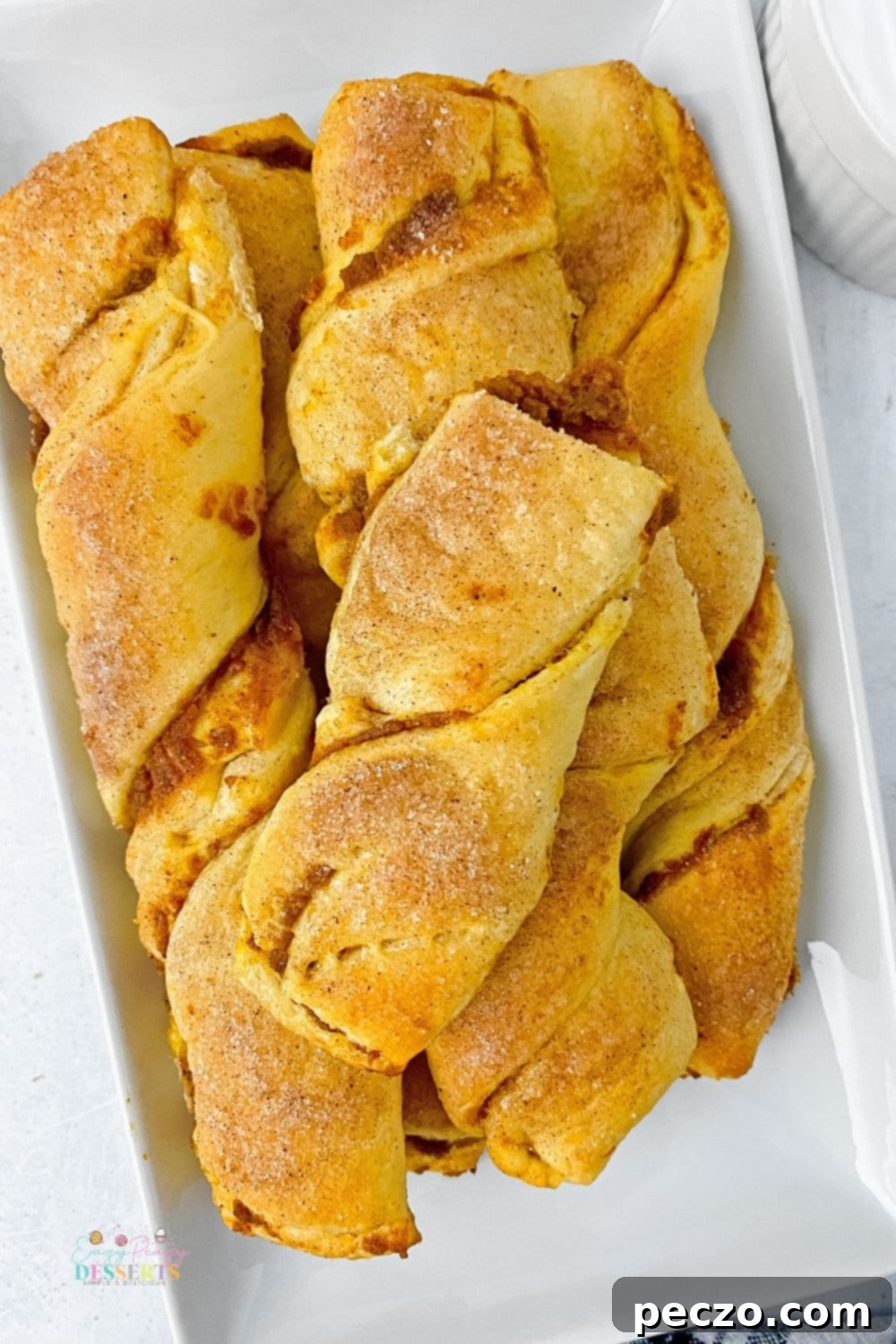 Pumpkin pie pastry strips on a serving plate, beautifully arranged and ready to be enjoyed.