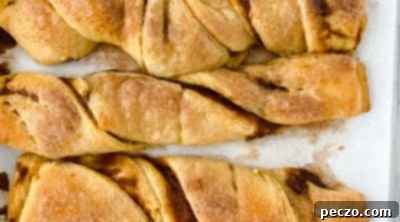 Pumpkin pastry twists dusted with cinnamon sugar, fresh out of the oven.
