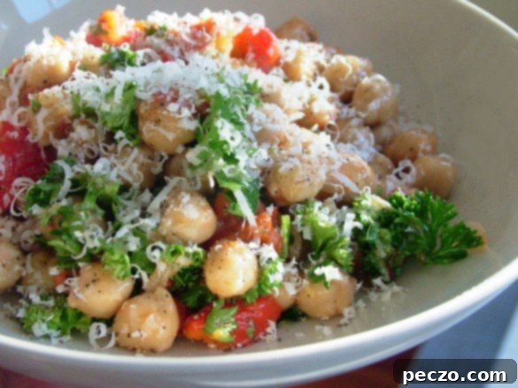 Chickpeas with roasted red pepper and fresh parsley in a bowl