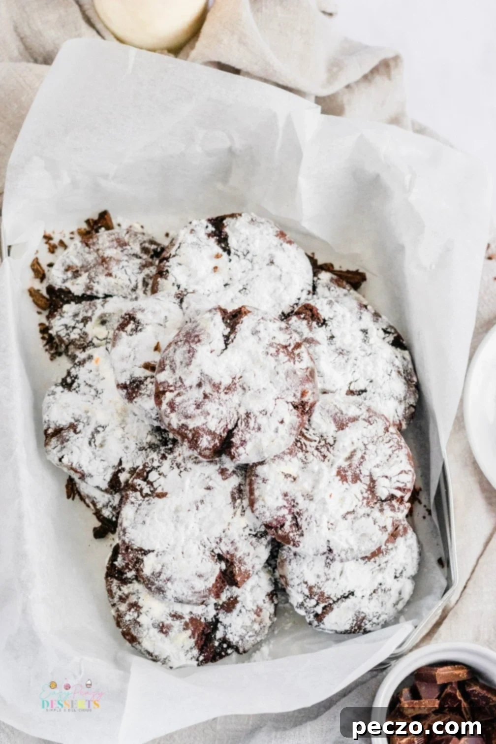 Crinkle cookies in a baking dish lined with baking paper