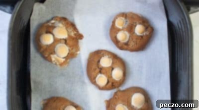 Freshly baked hot cocoa cookies cooling on a wire rack