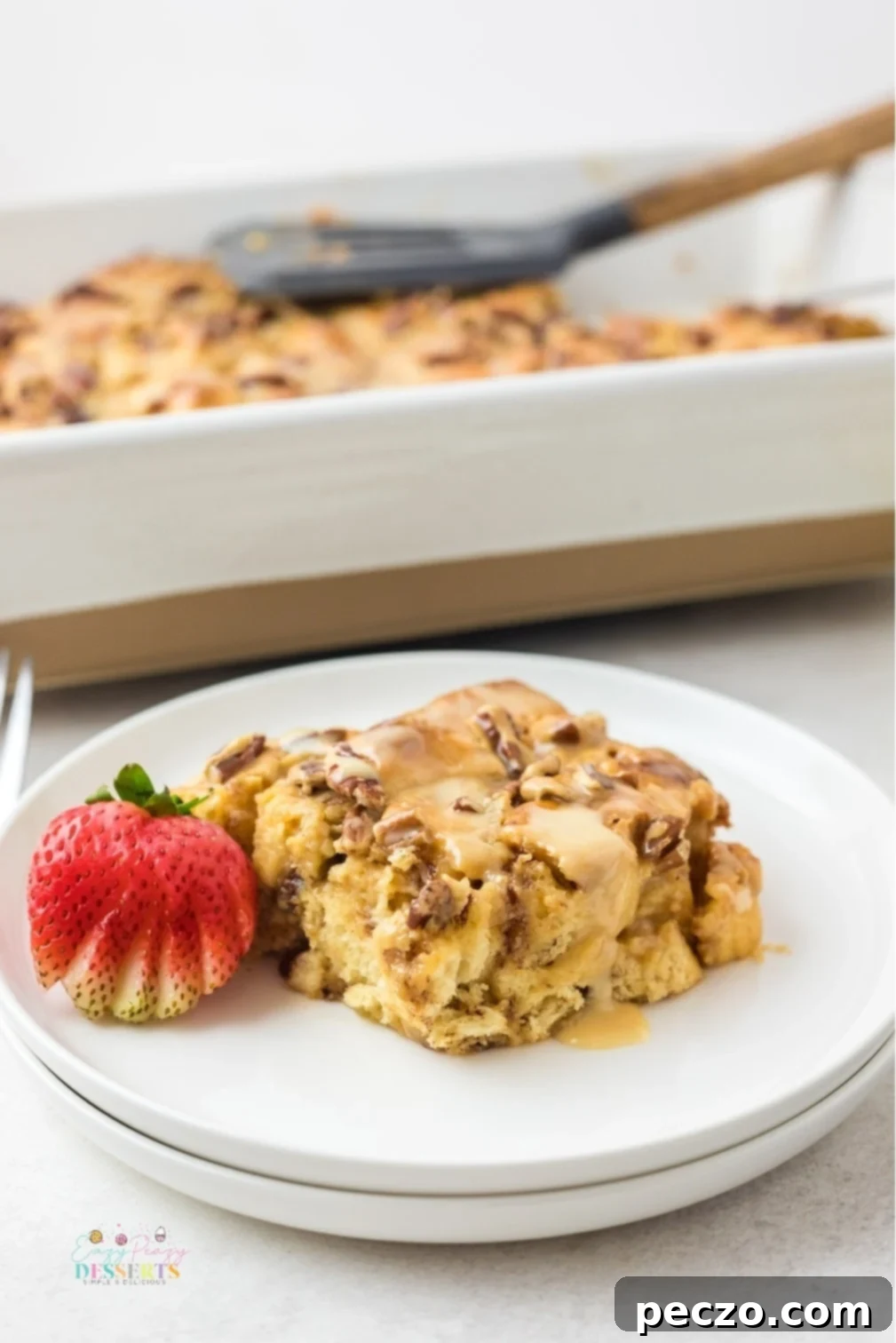 Delicious cinnamon roll casserole with a rich caramel drizzle