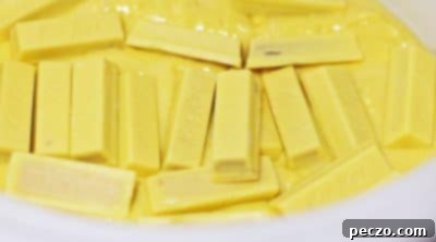 Adding chopped Kit Kat bars to cake mix