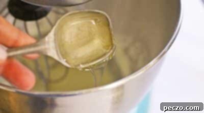 Mixing royal icing ingredients in a stand mixer