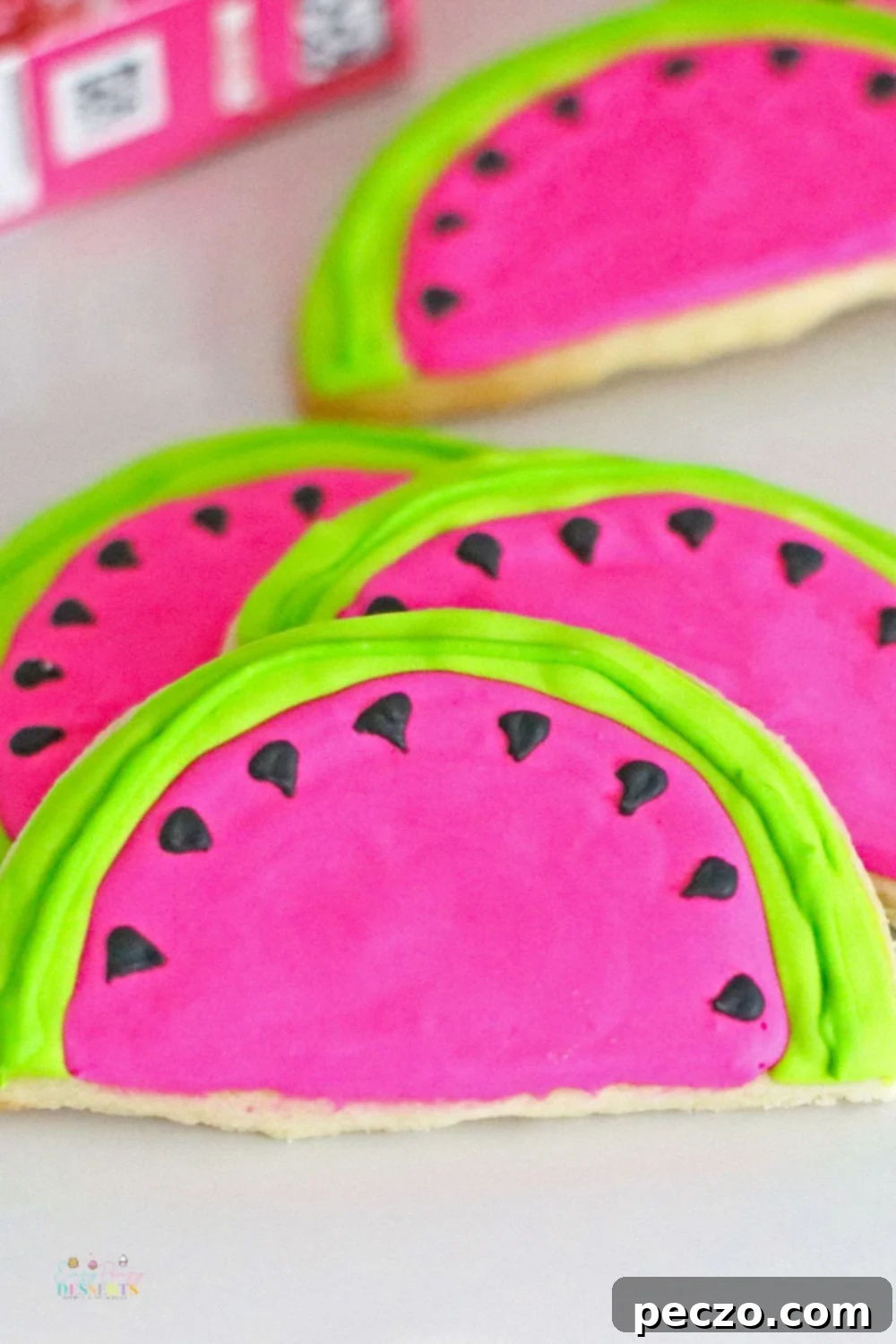 Close-up of watermelon slice cookies on a cooling rack