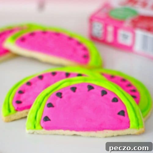 Watermelon sugar cookies with red, green, and black icing