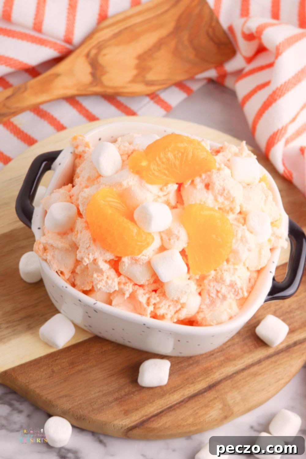 Close-up of creamy orange fluff salad with mandarin oranges and marshmallows